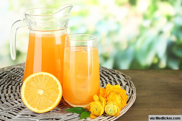 Glass and Pitcher full of orange juice