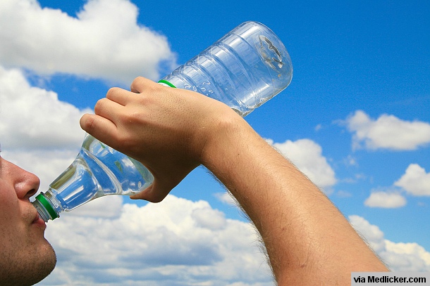 Man drinking water to prevent dehydration