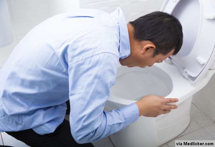 Man vomiting after drinking too much alcohol
