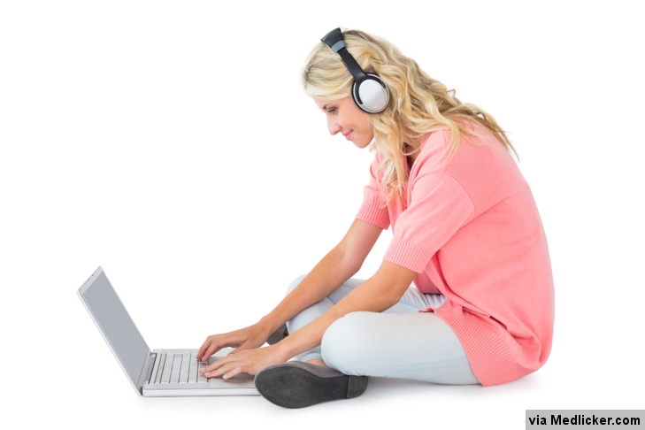Girl listening to music while studying