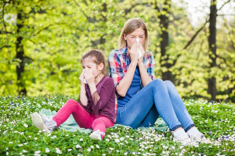 Allergic reaction - mom and daughter on a meadow