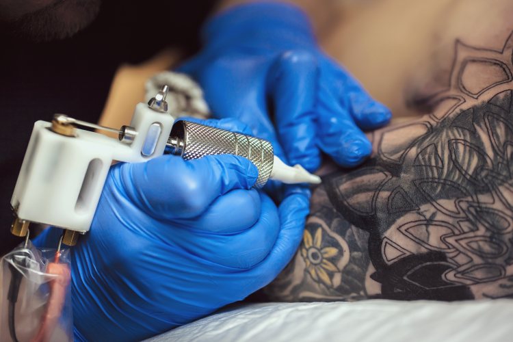 Tattoo artist in action